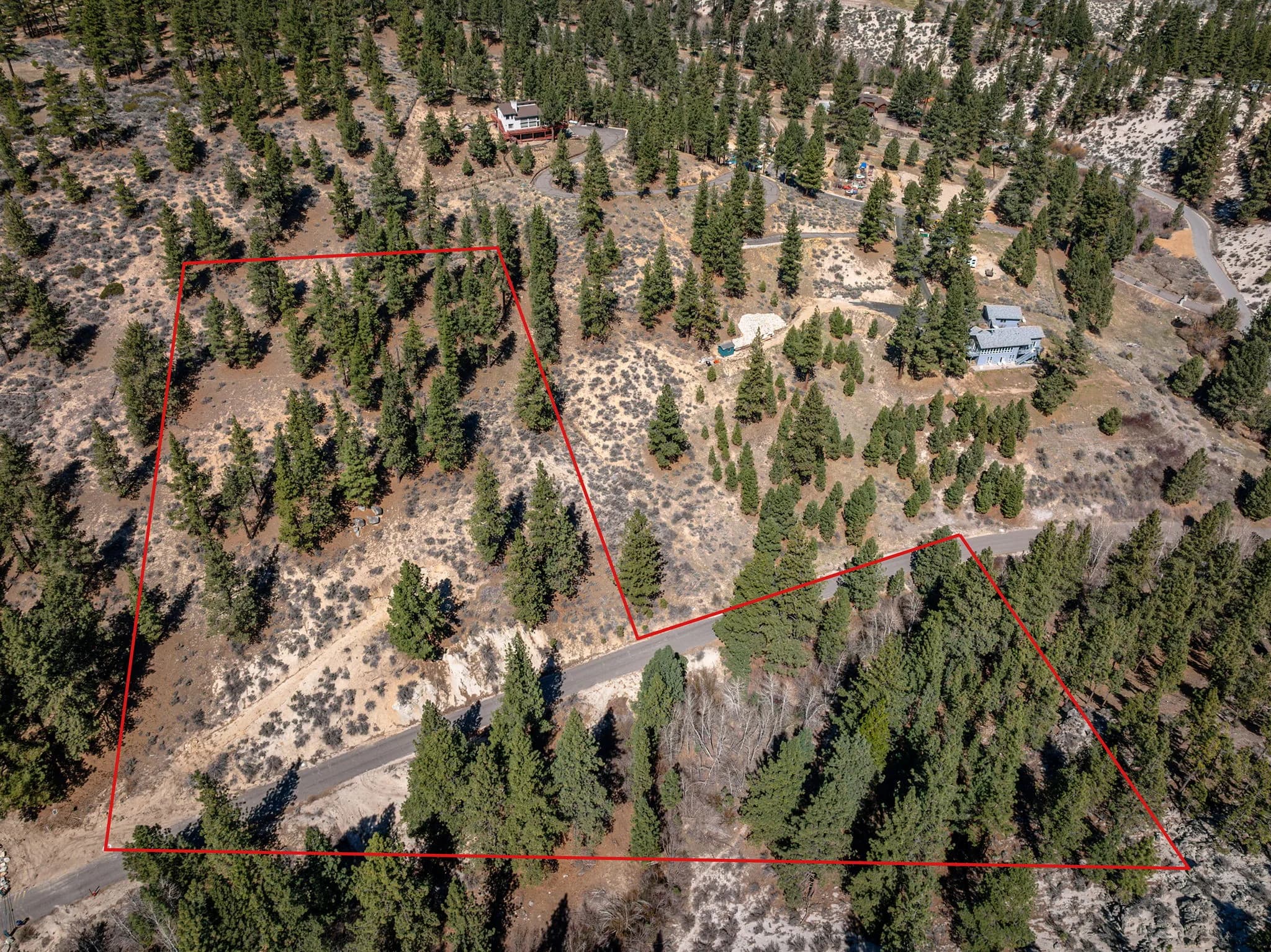 Aerial photograph with an approximate red outline indicating the reported 4960 Old Clear Creek Road parcel area