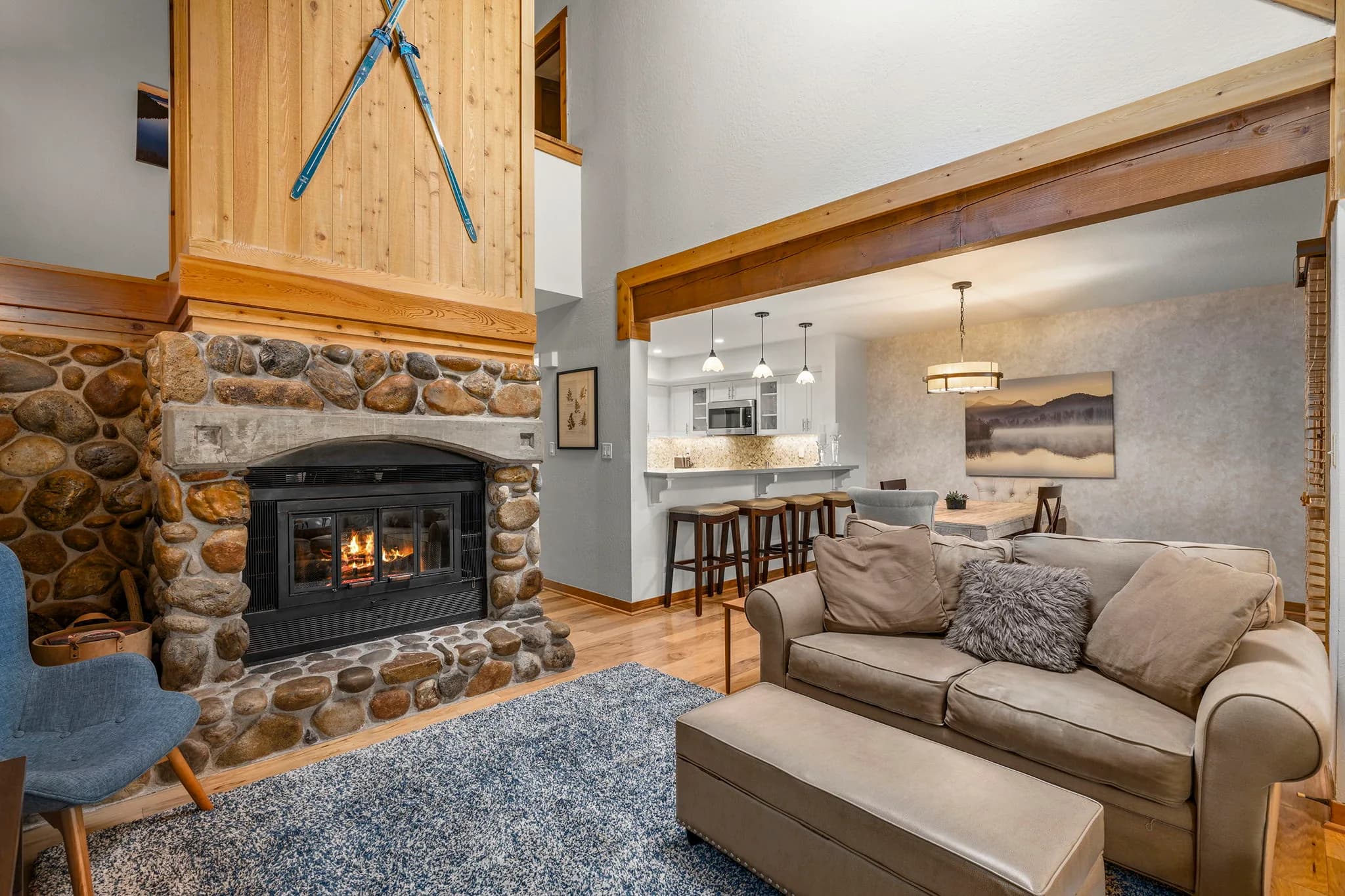 River-rock fireplace and open remodeled kitchen in Third Creek residence #46