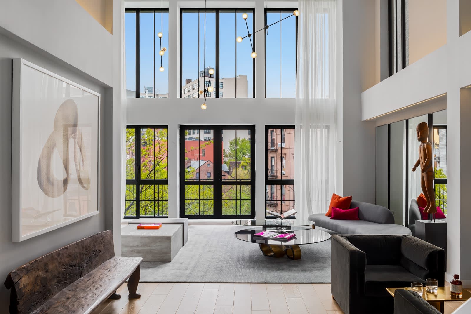 Contemporary loft interior with exposed brick and large windows